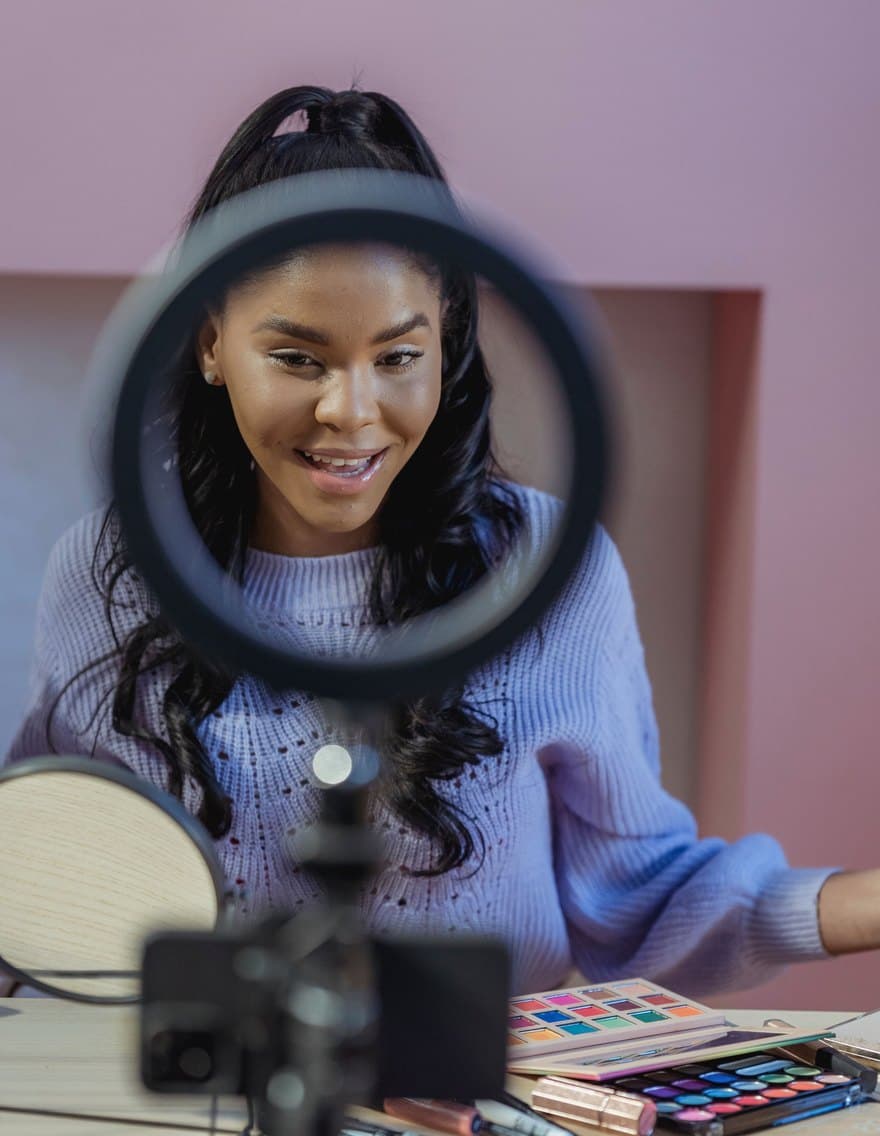 Creator filming with a ring light